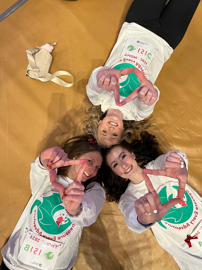 Neya Kratzer (lower left), Taylor Fleming (upper left), and Caroline Baum pre-THON