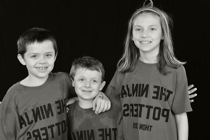 Siblings Manna, Corban (center), and Jay at THON 2015